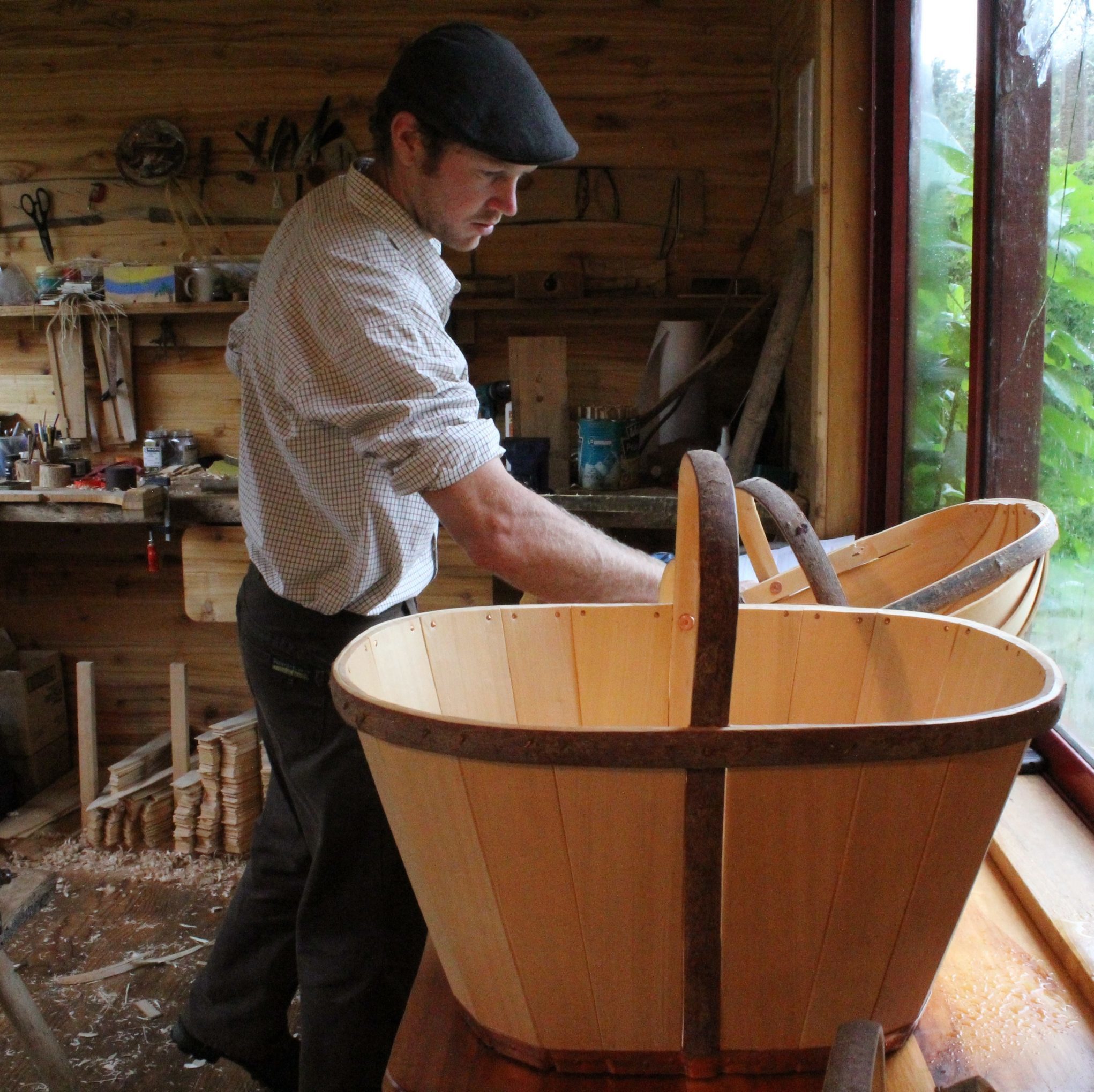 Tony in his workshop with a trug in the foreground