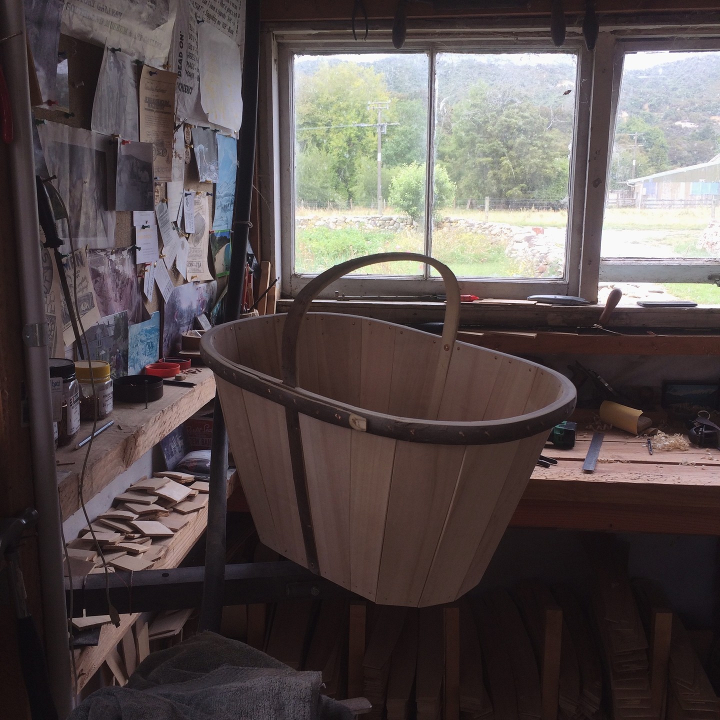 An almost complete Devon maund needing just the copper band around its base.
 
You may be able to see the jig that allows Tony to rotate the maund as he is working on it. Carefully prepared trug boards are stacked by shape under the bench.

#trugmaking #trugworkshop #hazel #willow #aspenpoplar #sustainablyharvested #handmadeinnz #devonmaund #splintbasket 
 #handmadegifts #handmadeingoldenbay #supportlocalnz #buynzmade #shoplocalnz #sustainablysourcedtimber #locallysourced #sustainablymade #chemicalfree #untreatedwood #goldenbay #goldenbaynz #anatoki